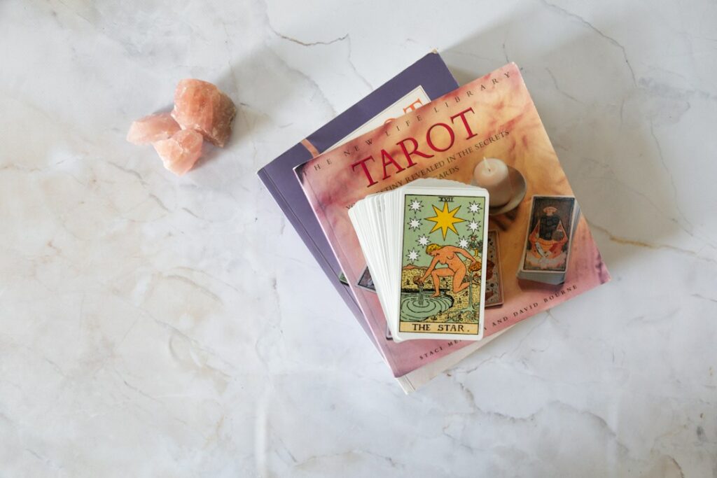 A bright, hopeful tarot arrangement featuring The Star card in warm natural light