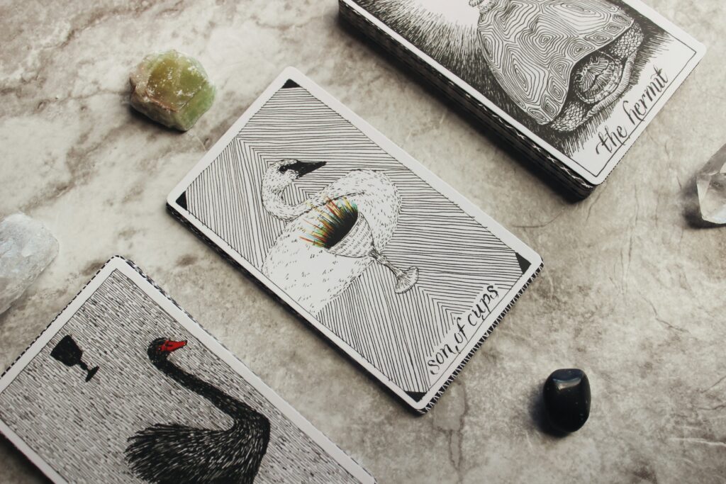 Tarot cards laid out as a reading spread on a table